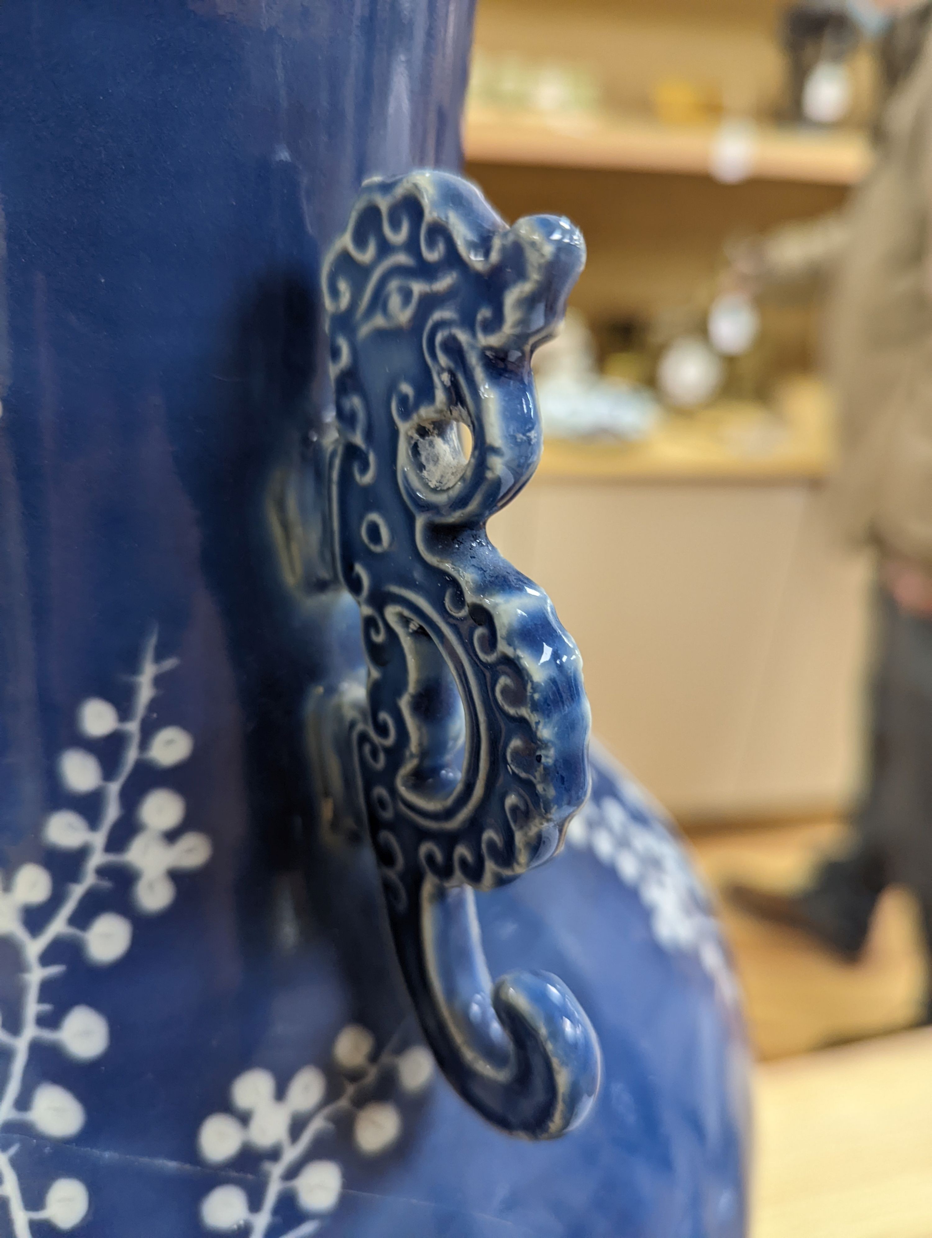 A pair of large 19th century Chinese slip decorated blue ground vases, restored, 59cm